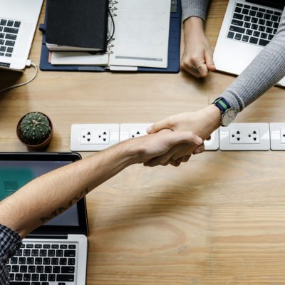 Business people shaking hands in agreement Business people shaking hands in agreement